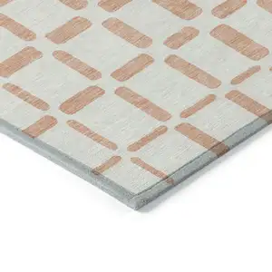 Photo of Peach And Beige Geometric Washable Indoor Outdoor Area Rug