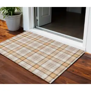 Photo of Peach And Beige Plaid Washable Indoor Outdoor Area Rug