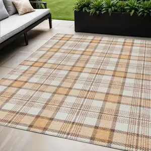 Photo of Peach And Beige Plaid Washable Indoor Outdoor Area Rug