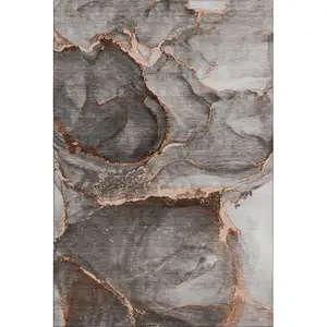 Photo of Peach And Gray Abstract Washable Area Rug With UV Protection