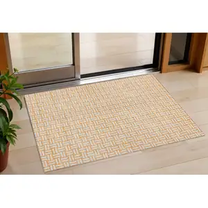 Photo of Peach And Gray Geometric Washable Indoor Outdoor Area Rug