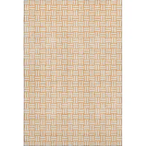 Photo of Peach And Ivory Abstract Geometric Washable Area Rug With UV Protection