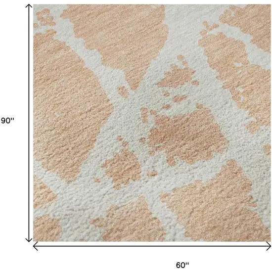 Peach And Ivory Abstract Washable Area Rug With UV Protection Photo 9
