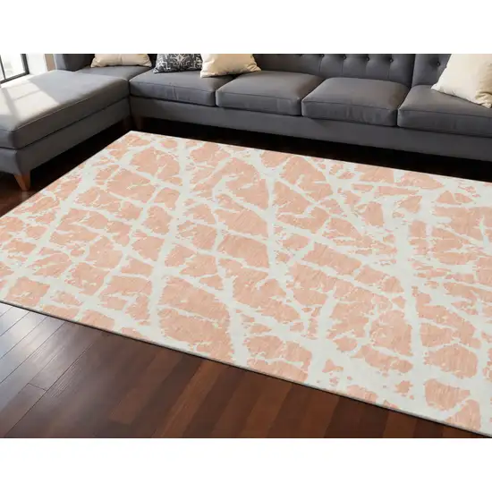 Peach And Ivory Abstract Washable Area Rug With UV Protection Photo 2