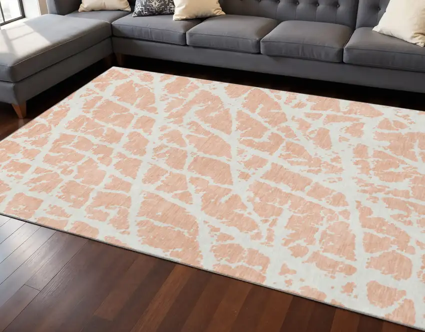 Peach And Ivory Abstract Washable Area Rug With UV Protection Photo 2