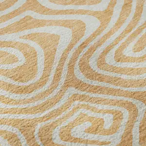 Photo of Peach And Ivory Abstract Washable Area Rug With UV Protection