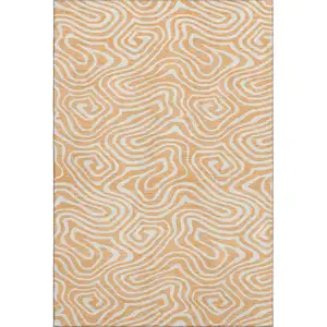 Photo of Peach And Ivory Abstract Washable Area Rug With UV Protection