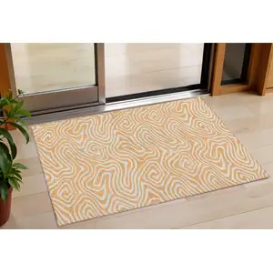 Photo of Peach And Ivory Abstract Washable Indoor Outdoor Area Rug