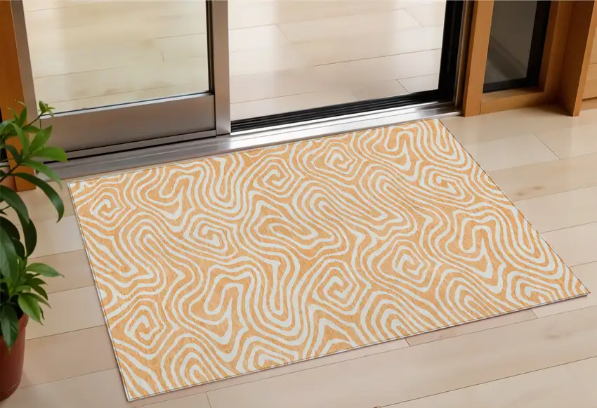 Peach And Ivory Abstract Washable Indoor Outdoor Area Rug Photo 1
