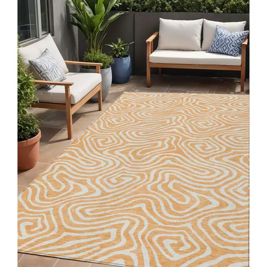 Peach And Ivory Abstract Washable Indoor Outdoor Area Rug Photo 1