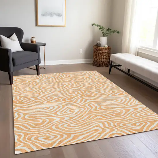 Peach And Ivory Abstract Washable Indoor Outdoor Area Rug Photo 9