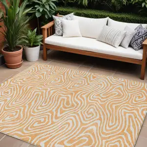 Photo of Peach And Ivory Abstract Washable Indoor Outdoor Area Rug