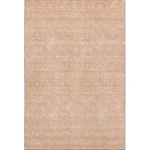 Photo of Peach And Ivory Floral Washable Area Rug With UV Protection