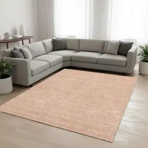 Photo of Peach And Ivory Floral Washable Area Rug With UV Protection