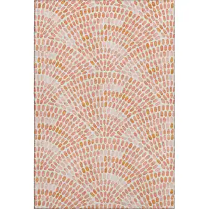 Photo of Peach And Ivory Geometric Washable Area Rug With UV Protection