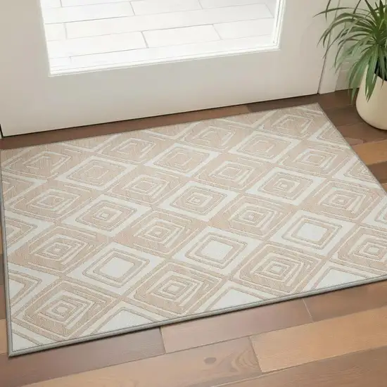 Peach And Ivory Geometric Washable Area Rug With UV Protection Photo 1