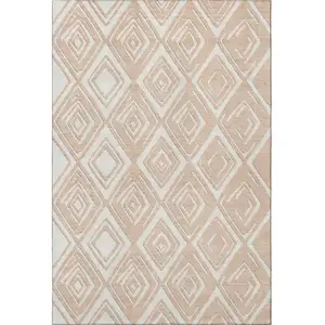 Photo of Peach And Ivory Geometric Washable Area Rug With UV Protection