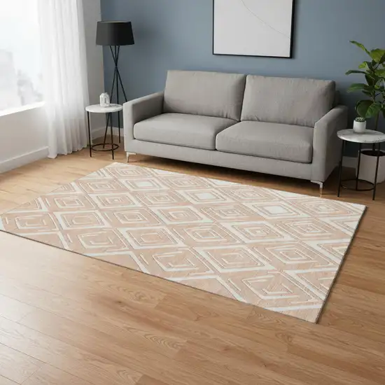 Peach And Ivory Geometric Washable Area Rug With UV Protection Photo 1