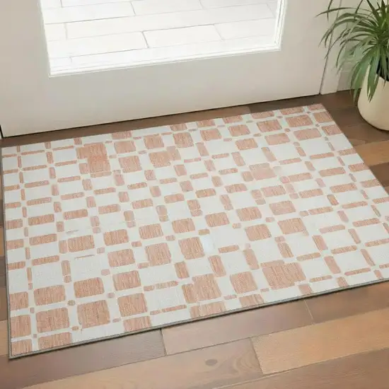 Peach And Ivory Geometric Washable Area Rug With UV Protection Photo 1