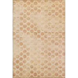 Photo of Peach And Ivory Geometric Washable Area Rug With UV Protection