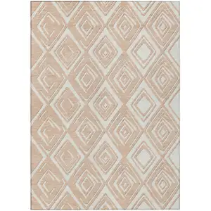 Photo of Peach And Ivory Geometric Washable Indoor Outdoor Area Rug