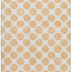 Photo of Peach And Ivory Polka Dot Washable Area Rug With UV Protection