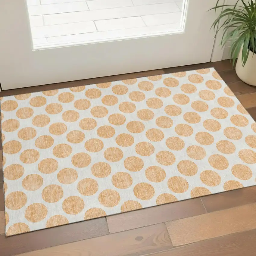 Peach And Ivory Polka Dot Washable Area Rug With UV Protection Photo 1