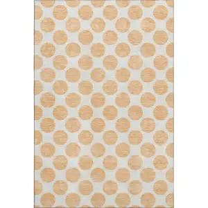 Photo of Peach And Ivory Polka Dot Washable Area Rug With UV Protection