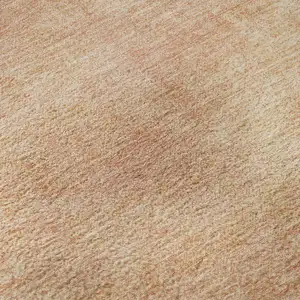 Photo of Peach And Salmon Abstract Washable Area Rug With UV Protection