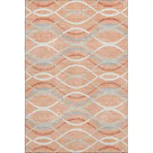Photo of Peach Gray And Ivory Abstract Washable Area Rug With UV Protection