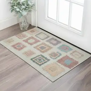 Photo of Peach Ivory And Blue Geometric Washable Area Rug With UV Protection