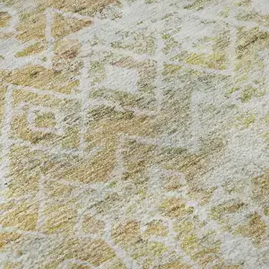 Photo of Peach Ivory And Gold Geometric Washable Area Rug With UV Protection