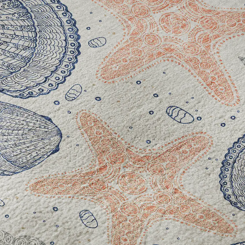 Peach Ivory And Navy Blue Geometric Washable Area Rug With UV Protection Photo 9