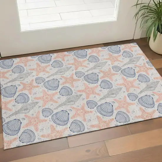 Peach Ivory And Navy Blue Geometric Washable Area Rug With UV Protection Photo 1