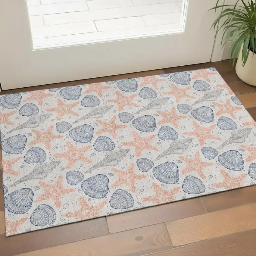Peach Ivory And Navy Blue Geometric Washable Area Rug With UV Protection Photo 1