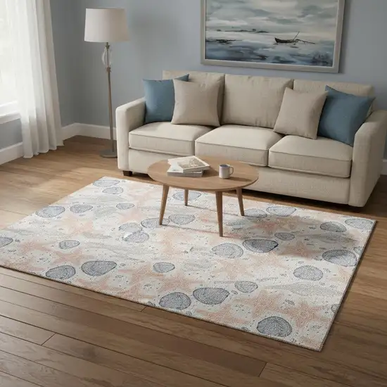 Peach Ivory And Navy Blue Geometric Washable Area Rug With UV Protection Photo 1