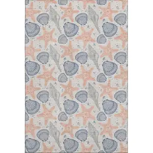 Photo of Peach Ivory And Navy Blue Geometric Washable Area Rug With UV Protection