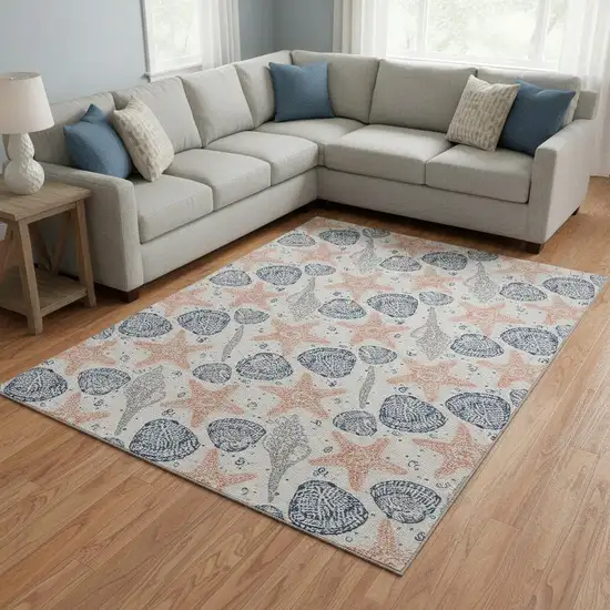 Peach Ivory And Navy Blue Geometric Washable Area Rug With UV Protection Photo 1