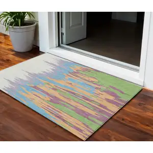 Photo of Peach Purple And Green Abstract Washable Indoor Outdoor Area Rug
