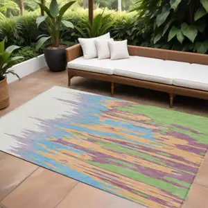 Photo of Peach Purple And Green Abstract Washable Indoor Outdoor Area Rug