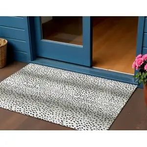 Photo of Pearl And Black Animal Print Washable Indoor Outdoor Area Rug