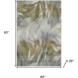 Photo of Pewter And Gold Abstract Washable Area Rug With UV Protection