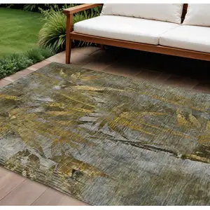 Photo of Pewter And Gold Botanical Leaves Washable Indoor Outdoor Area Rug