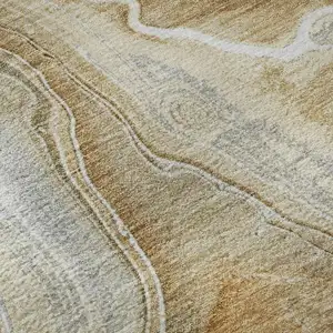 Photo of Pewter Tan And Ivory Abstract Washable Area Rug With UV Protection