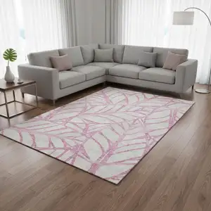 Photo of Pink And Beige Floral Washable Area Rug With UV Protection