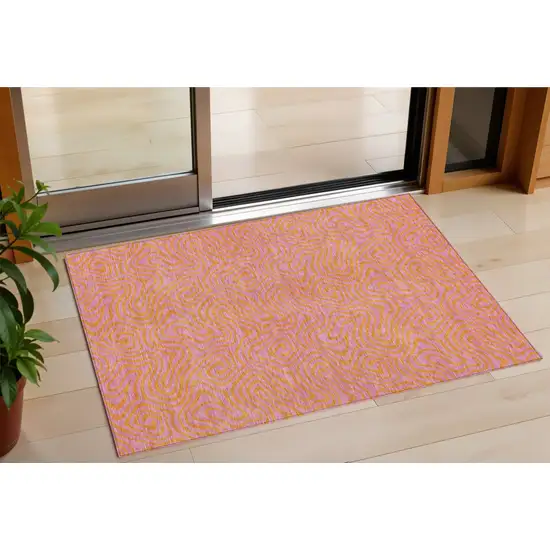 Pink And Copper Abstract Washable Indoor Outdoor Area Rug Photo 1