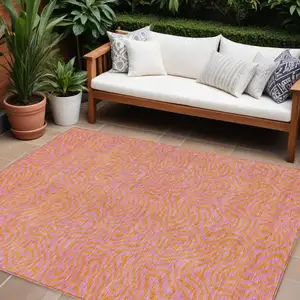 Photo of Pink And Copper Abstract Washable Indoor Outdoor Area Rug