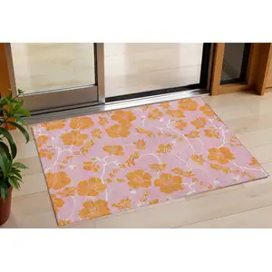 Photo of Pink And Copper Floral Washable Indoor Outdoor Area Rug