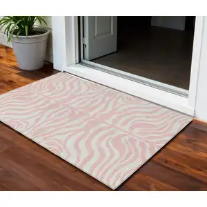 Photo of Pink And Gray Animal Print Washable Indoor Outdoor Area Rug