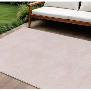 Photo of Pink And Gray Geometric Washable Indoor Outdoor Area Rug